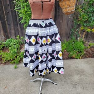Elegant Black and White A-Line Skirt with Floral Accents